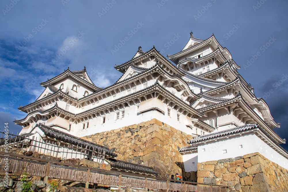 The view of Himeji Castle in autumn, a hilltop Japanese castle complex. It is located in the Hyogo Prefecture of Japan,  one of the first UNESCO World Heritage Sites.