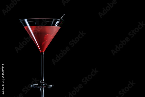 Cosmopolitan cocktail with cherry in martini glass