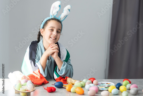 little girl with uae flag for easter