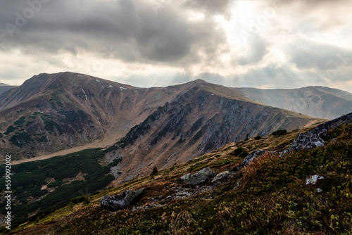 Rocky mountain range with sunrays