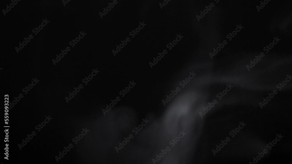 Coffee steam slowly rising like smoke in the darkness Coffee steam slowly rising like smoke in the darkness