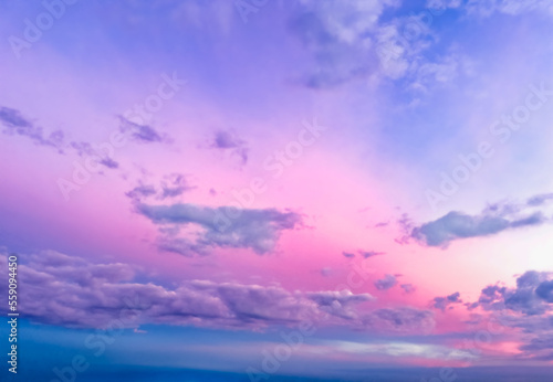 Abstract background. Bright, pink sky with clouds, sunset, sunrise in the sky. Natural background. Copy space