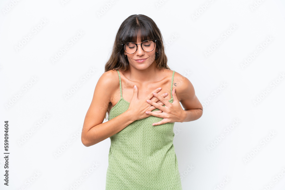 Young caucasian woman isolated on white background having a pain in the heart Young caucasian woman isolated on white background having a pain in the heart