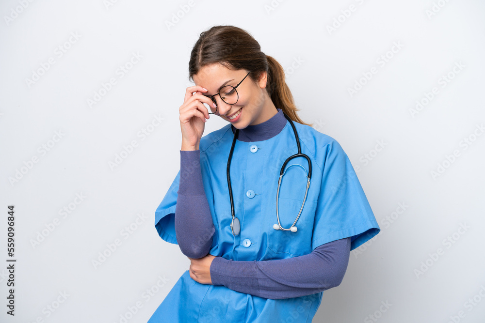 Young caucasian nurse woman isolated on white background laughing
