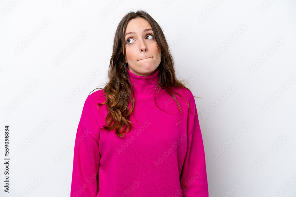 Young caucasian woman isolated on white background having doubts while looking up Young caucasian woman isolated on white background having doubts while looking up