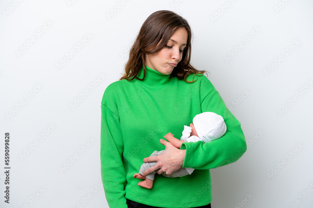 Young caucasian woman with her cute baby isolated on white background with sad expression Young caucasian woman with her cute baby isolated on white background with sad expression