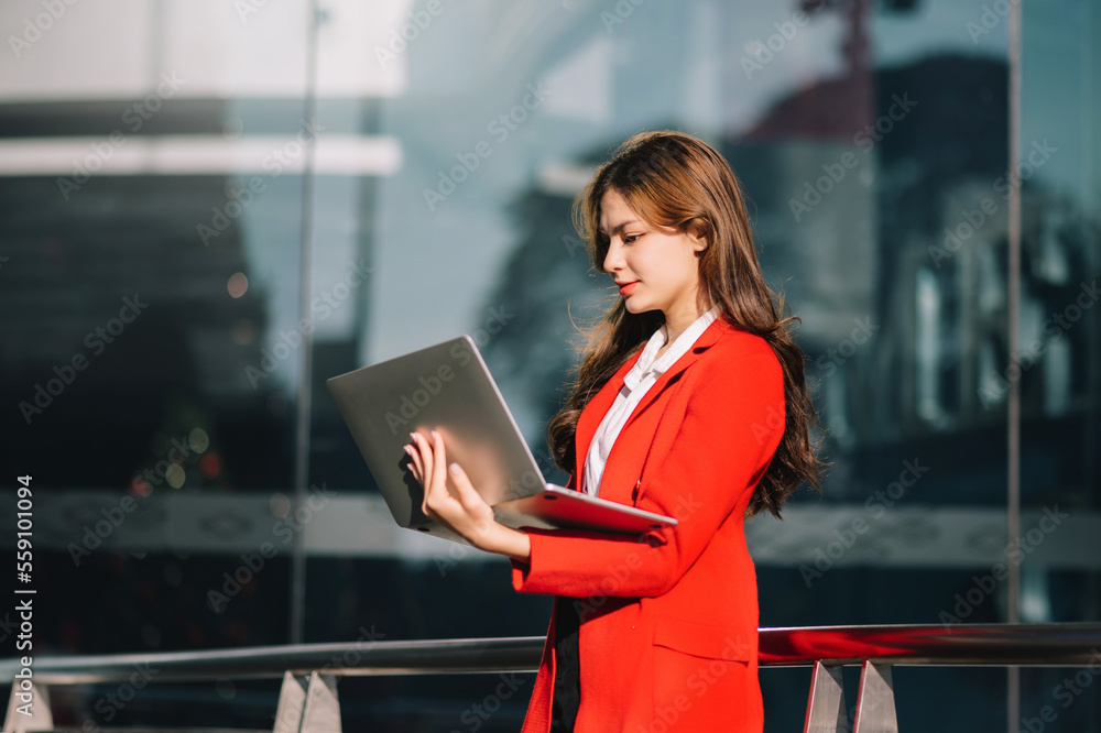 Portrait of business woman holding laptop.Office worker at business center.. Portrait of business woman holding laptop.Office worker at business center..