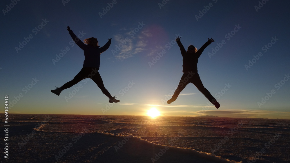 Fototapeta premium people jumping on the Uyuni