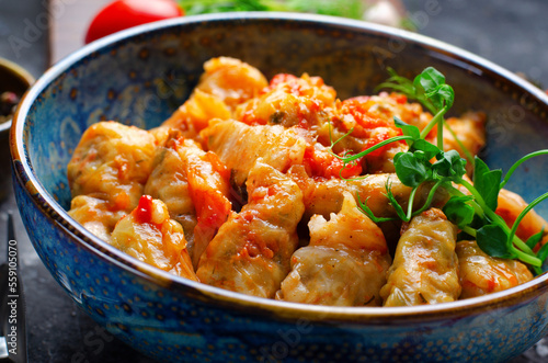 Homemade Cabbage rolls with meat, rice and vegetables also known as sarma, golubtsy, dolma on Rustic Background