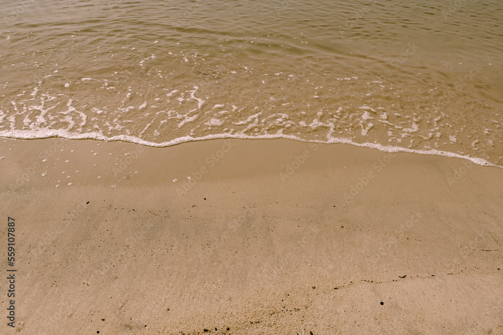 background of clean beach sand and sea water. background of clean beach sand and sea water.