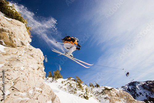 Greg Liscot skiing off a cliff at Snowbird, Utah photo
