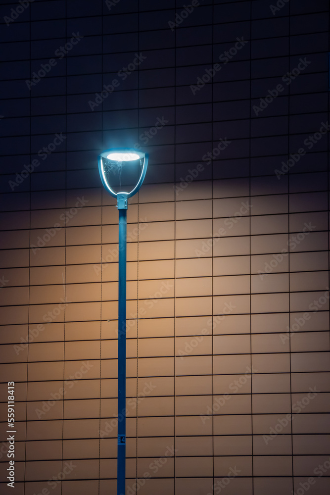 isolated lamp post against brick background isolated lamp post against brick background