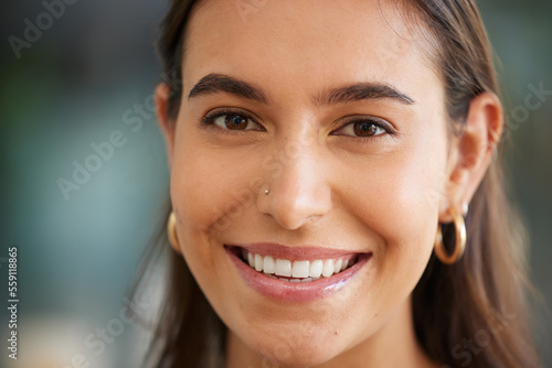 Portrait, beauty and skincare with a woman, happy inside with a nose ring peircing and smile on her face. Skin, cosmetics and luxury with an attractive young female smiling for a facial product