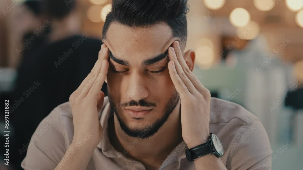 Indian Hispanic ethnic man suffer with headache sad depressed guy businessman has business problem frustrated with pain massage head dizzy unhappy male feel migraine anxiety stress trouble sickness Indian Hispanic ethnic man suffer with headache sad depressed guy businessman has business problem frustrated with pain massage head dizzy unhappy male feel migraine anxiety stress trouble sickness