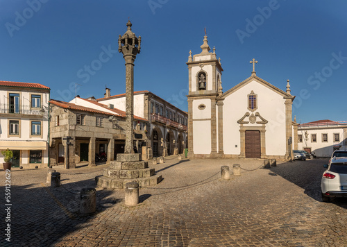 View of the pillory and church of Saint Peter in the historic center of the city of Trancoso in Portugal.