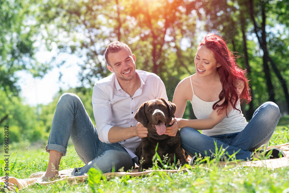 Couple with a dog in the park