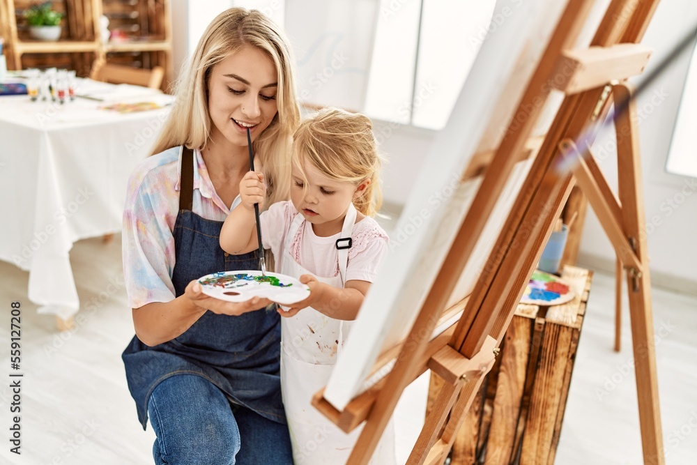 Mother and daughter smiling confident drawing at art studio Mother and daughter smiling confident drawing at art studio