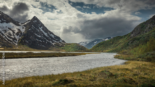 River in mountain landscape at Knutshoe in Jotunheimen National Park in Norway photo