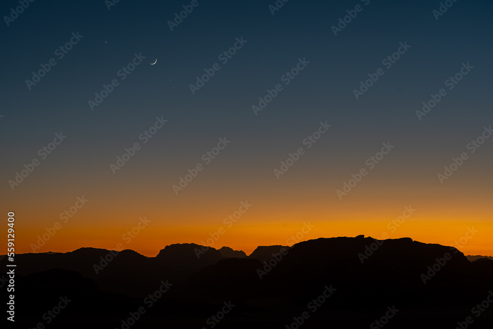 Sunset over the mountains in the Wadi Rum desert in Jordan
