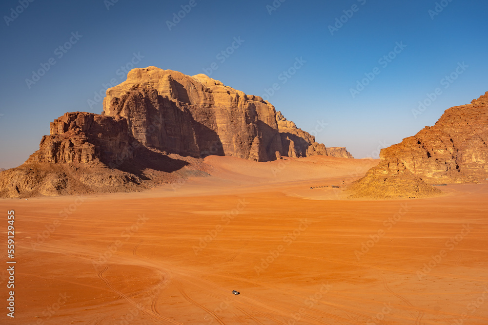 Fototapeta premium Beautiful desert surrounded mountains in Wadi Rum, Jordan