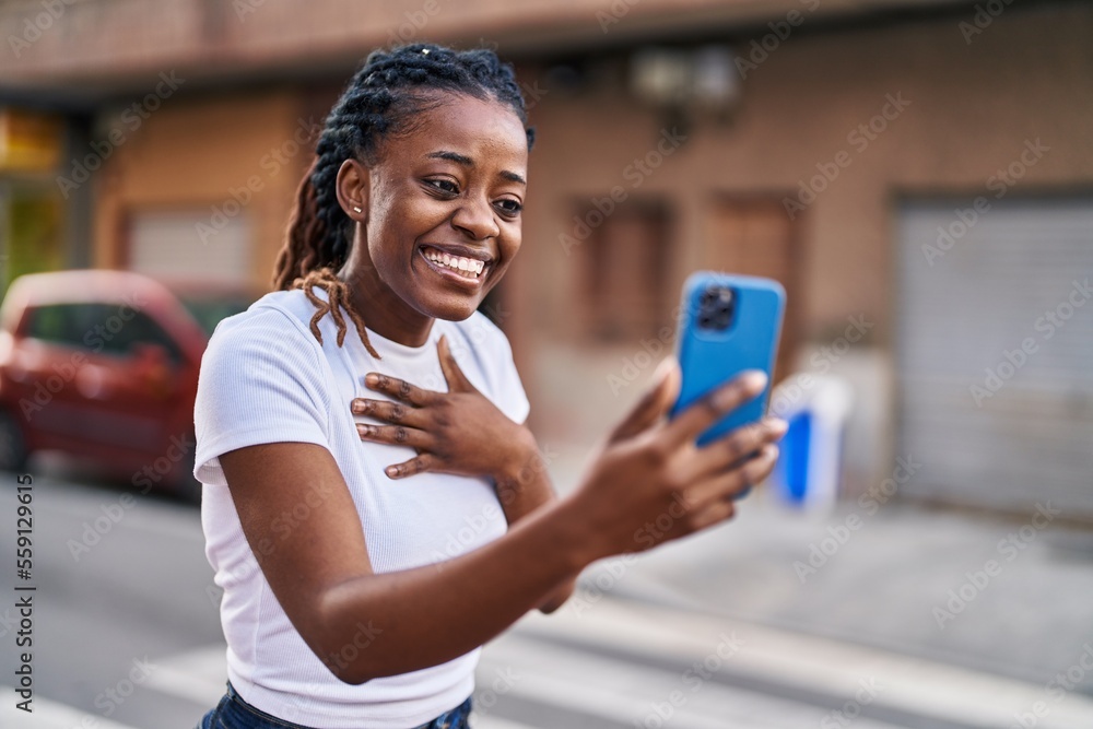African american woman smiling confident having video call at street African american woman smiling confident having video call at street