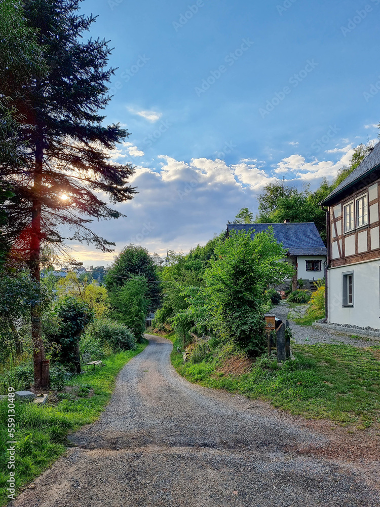 road in the mountains with half-timbered house at the side road in the mountains with half-timbered house at the side