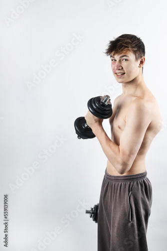 A shirtless 17 year old muscular boy