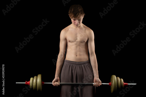 A shirtless 17 year old muscular boy