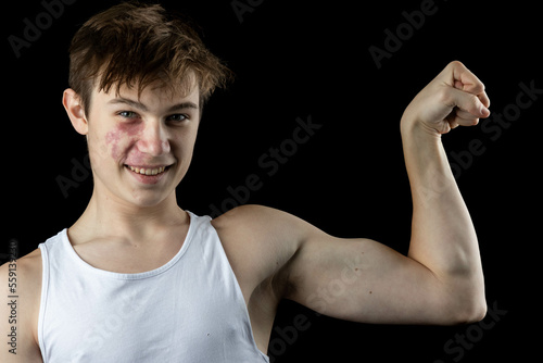 A 17 Year old wearing a white tank top