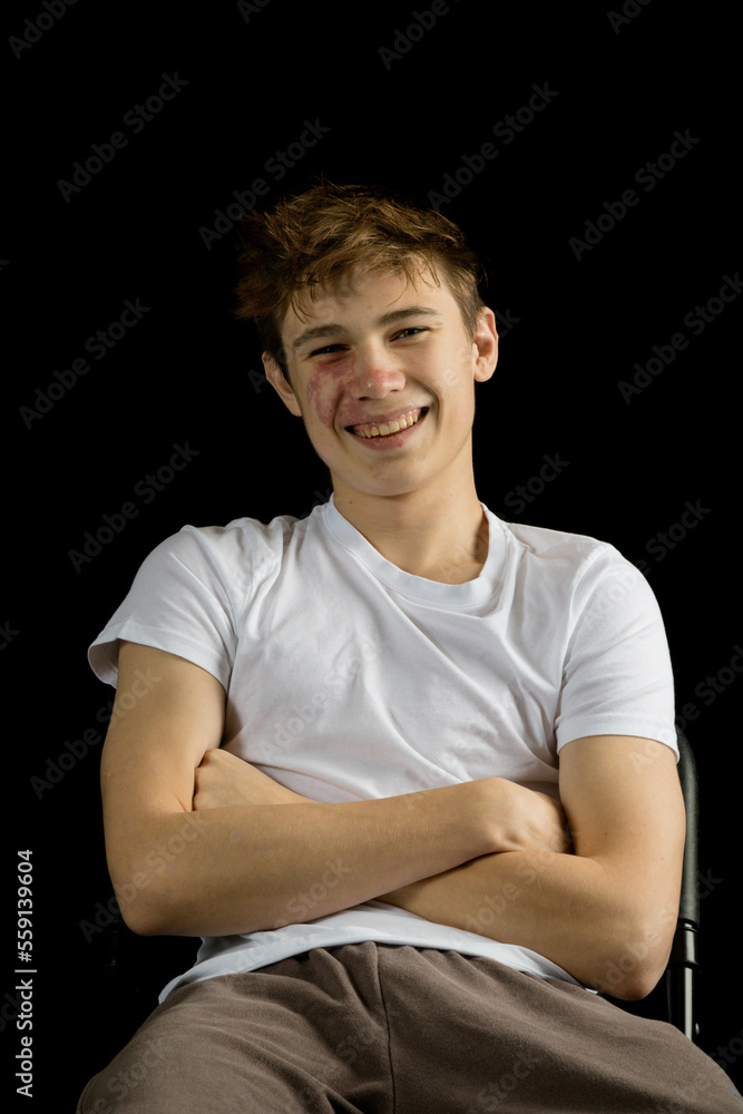 Portrait of a 17 year old boy on a black background Portrait of a 17 year old boy on a black background