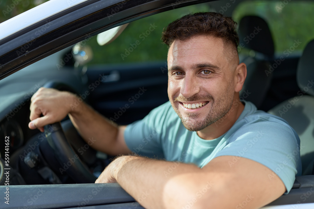 Young hispanic man smiling confident driving car at street Young hispanic man smiling confident driving car at street