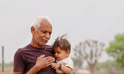 A little child plays out in grandfather's womb
