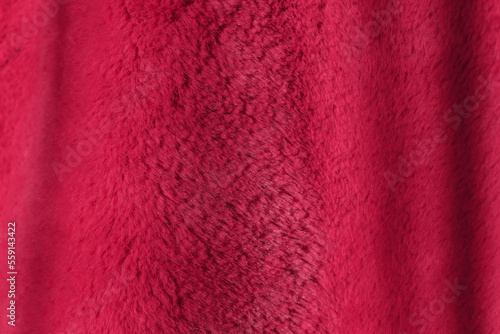 Red delicate soft background of plush fabric. Viva Magenta color decor 
