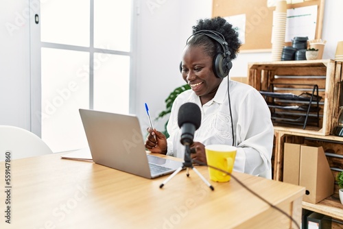 Fotografie Young african american woman broadcaster smiling confident working at radio stud