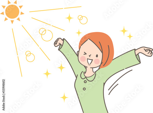 太陽の光を浴びながら伸びをする若い女性