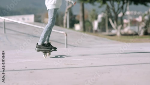 Girl riding on waveboard with two wheels, modern street skate sports of teenagers, casterboard or ripstick for balance ride. photo