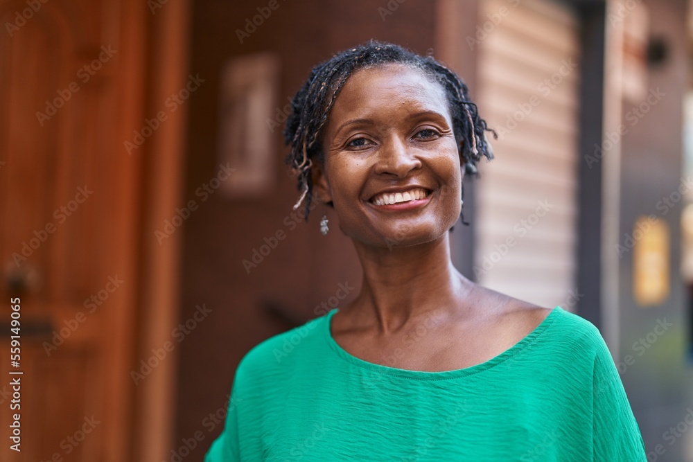 Middle age african american woman smiling confident standing at street Middle age african american woman smiling confident standing at street