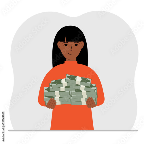 A woman is holding a large pile of paper money.