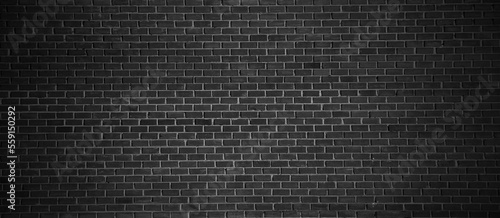 Rough black brick wall texture or background