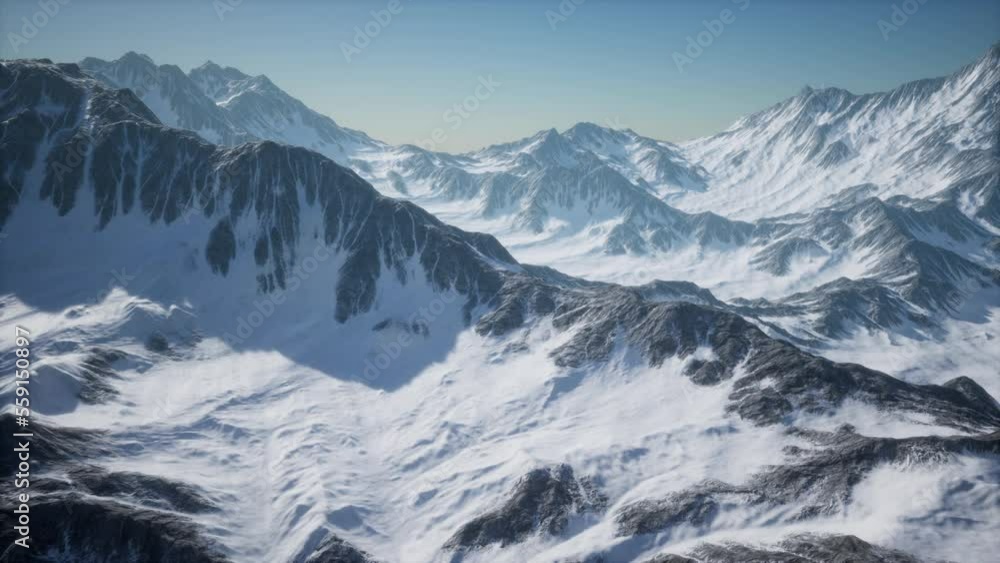 Aerial View from Airplane of Blue Snow Covered Canadian Mountain Landscape Aerial View from Airplane of Blue Snow Covered Canadian Mountain Landscape