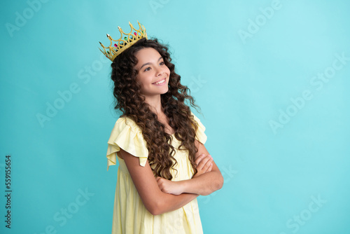 Happy teenager. Girls birthday party, funny kid in crown. Imagine herself a queen, child wear diadem. Successful teenager wear luxury beauty queen crown, success.