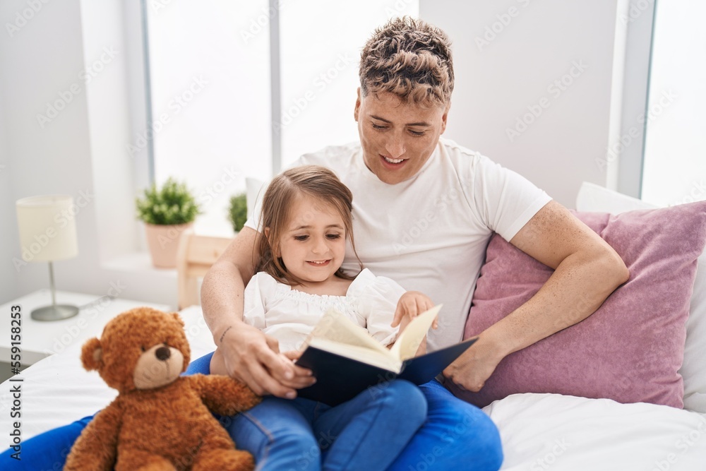 Father and daughter father and daughter reading book holding teddy bear at bedroom Father and daughter father and daughter reading book holding teddy bear at bedroom