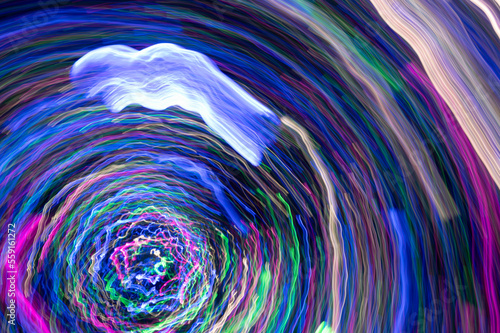 Colorful light cycle lines  abstract background  flowing fast movement of light trail.