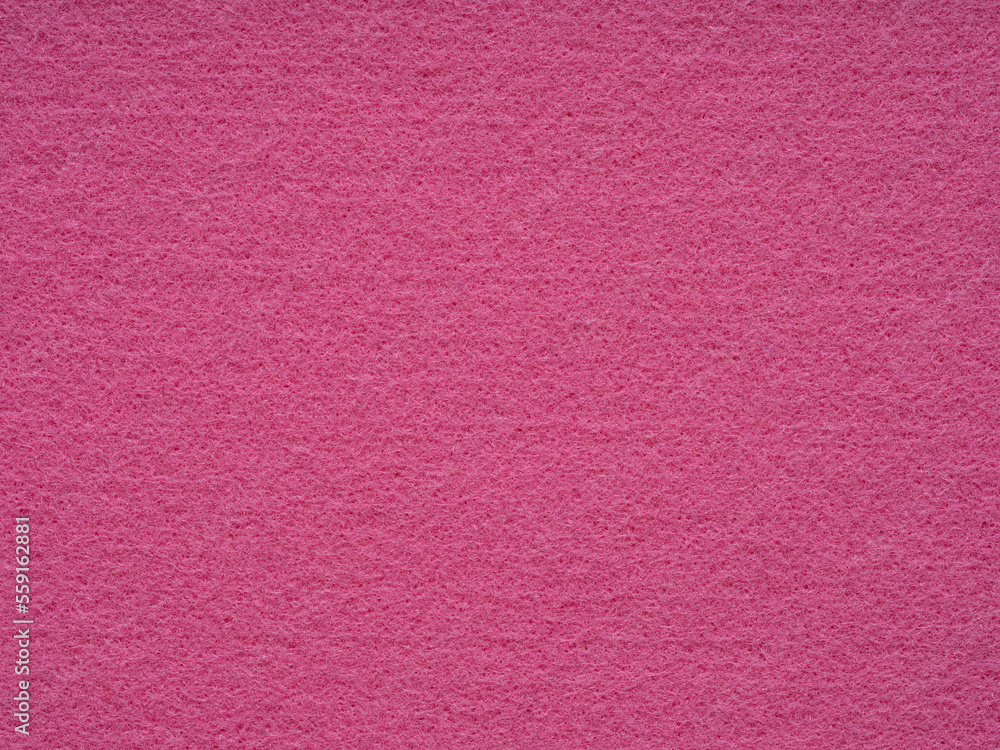 Fototapeta premium Texture of crimdon, purple, pink felt close-up. Handicraft concept, crafts, DIY, do it yourself. Top view, flat lay, layout, place for text. For shops with goods for creativity patchwork or art work.