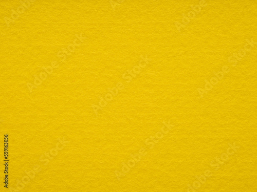 Texture of yellow, felt close-up. Handicraft concept, crafts, DIY, do it yourself. Top view, flat lay, layout, place for text. For shops with goods for creativity patchwork or art work.