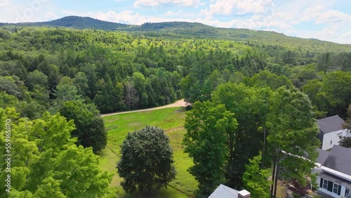 Flying up to Hersey Mountain in summer from town center of New Hampton, New Hampshire NH, USA. Hersey Mountain is between town of New Hampton and Sanbornton.  photo