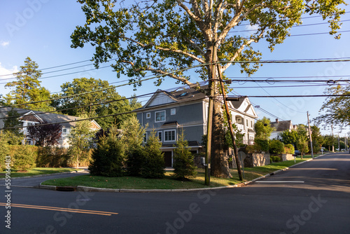 Fototapeta Naklejka Na Ścianę i Meble -  Beautiful Neighborhood Homes with Green Trees in Greenwich Connecticut during the Summer