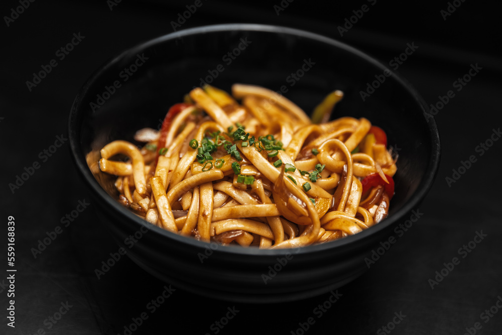 chinese noodles on a black background chinese noodles on a black background