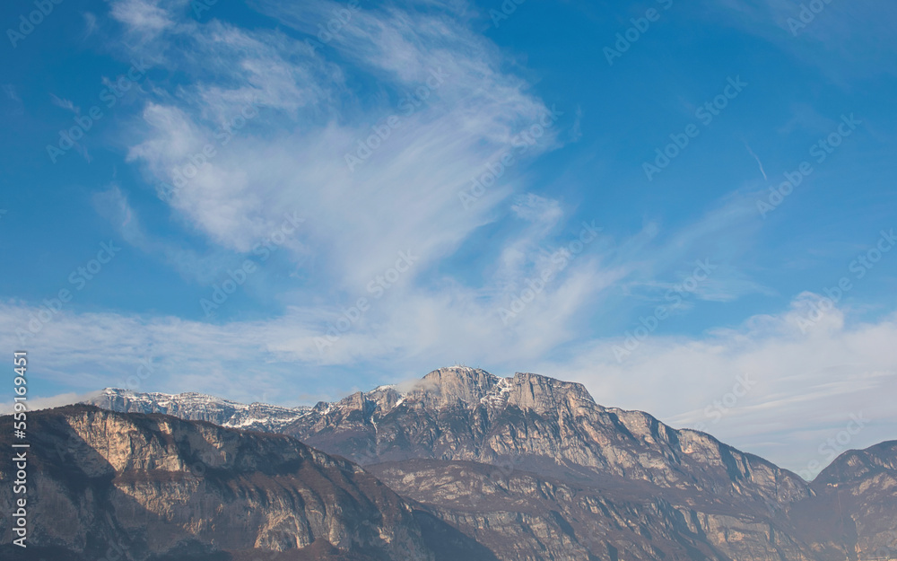 Clouds in the sky above the mountains of the Trentino area, Italy.