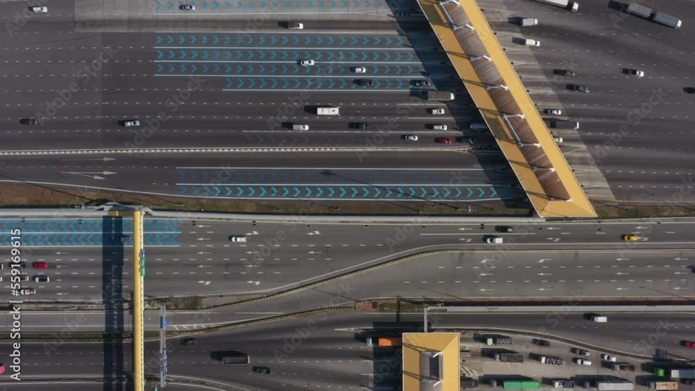 Aerial view of Cars Passing Through The Automatic Point Of Payment On motorway Toll Road at night. Point Of Toll Highway, Toll Station. Highway Toll Plaza Or Turnpike Or Charging Point, Expressway. 4k Aerial view of Cars Passing Through The Automatic Point Of Payment On motorway Toll Road at night. Point Of Toll Highway, Toll Station. Highway Toll Plaza Or Turnpike Or Charging Point, Expressway. 4k